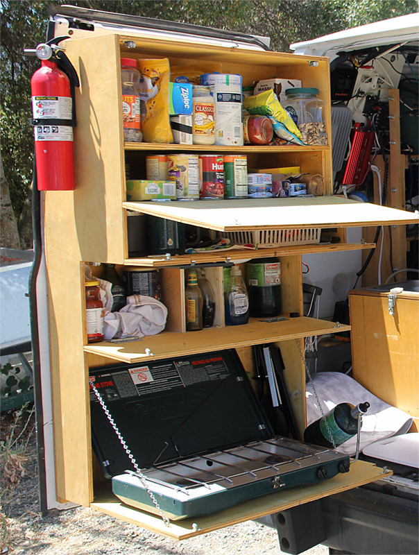 econoline camper van kitchen on the door picture. Food storage for two people for a week off grid.